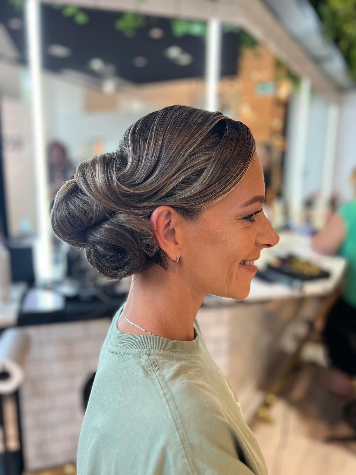 Bridal low updo with finger-wave detailing through the front